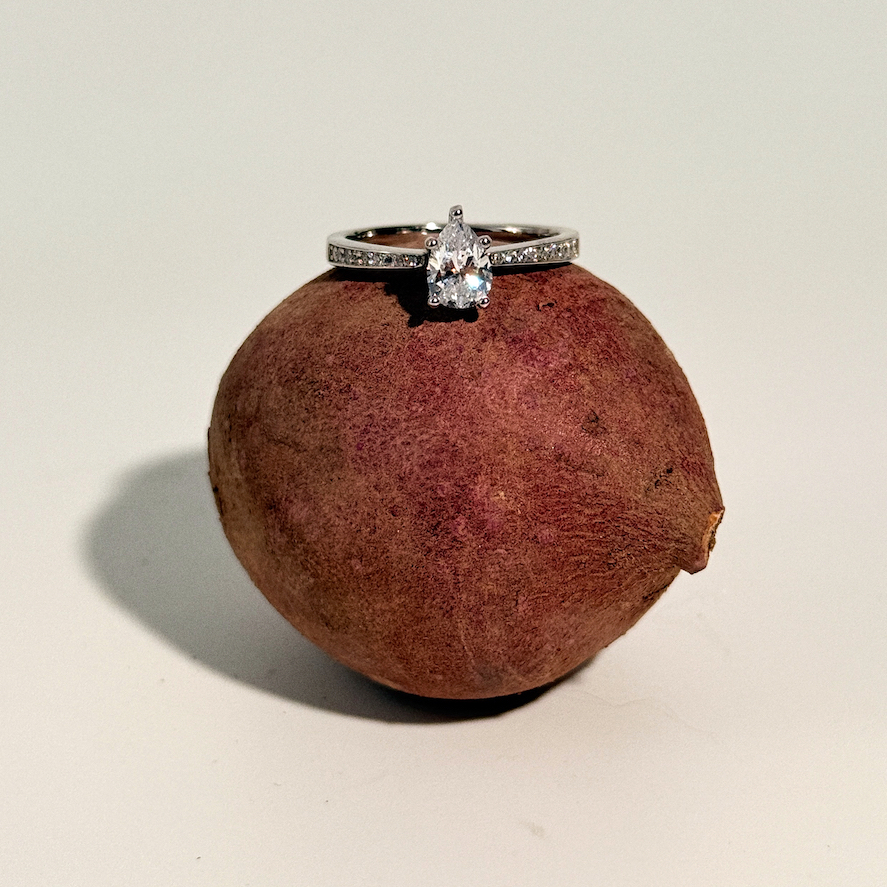 pear 0.50ct diamond band.webp